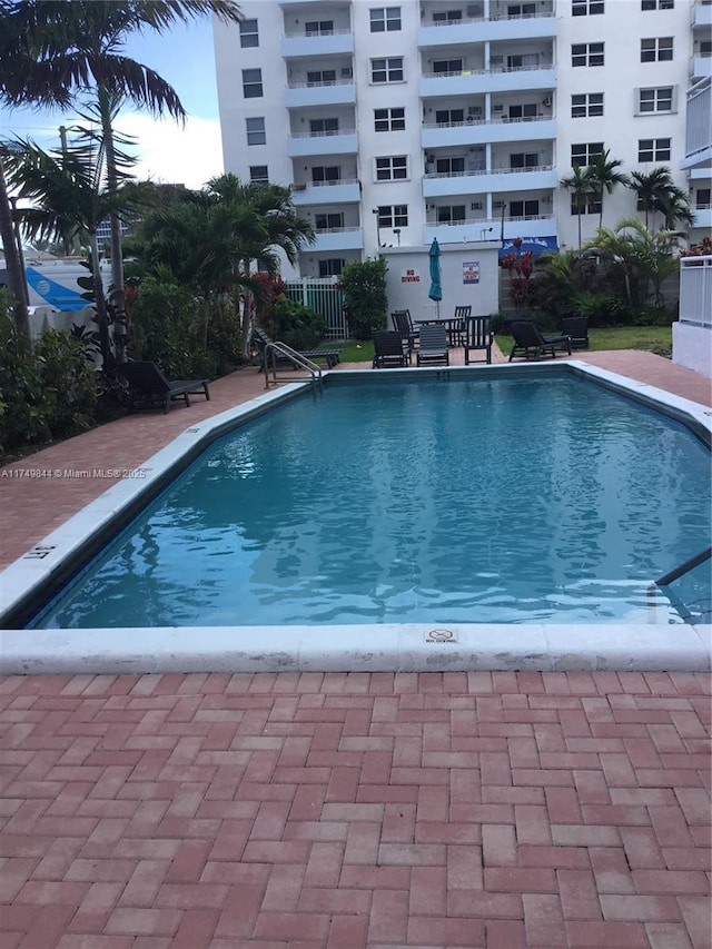 community pool featuring a patio area