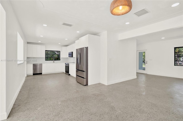 kitchen with white cabinetry, modern cabinets, visible vents, and appliances with stainless steel finishes