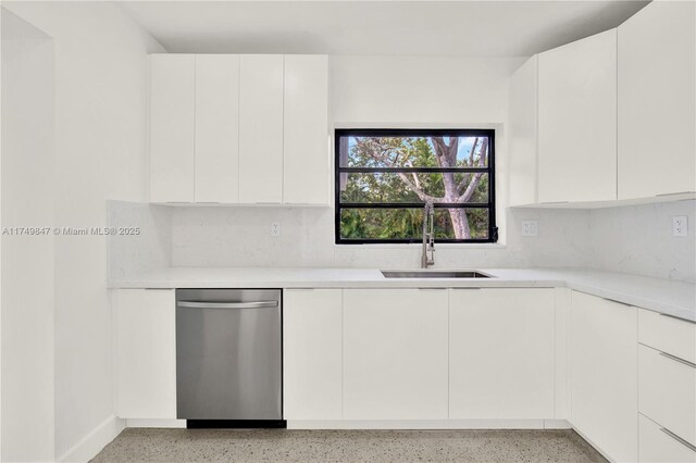 kitchen with a sink, modern cabinets, light speckled floor, and dishwasher