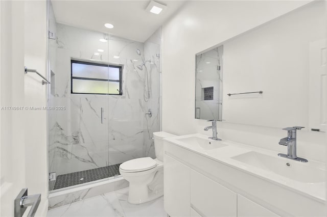 bathroom featuring a sink, a marble finish shower, toilet, and marble finish floor