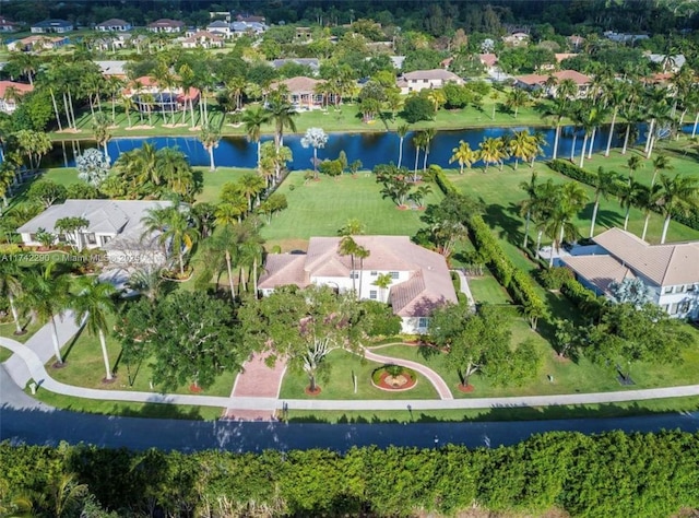 drone / aerial view featuring a water view and a residential view