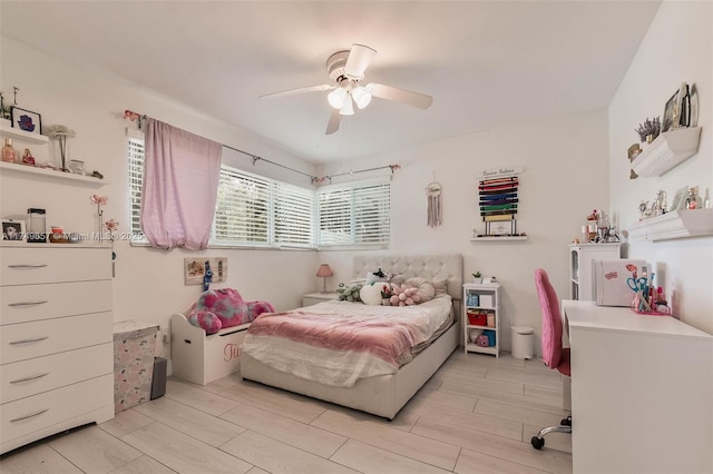 bedroom featuring wood tiled floor and ceiling fan