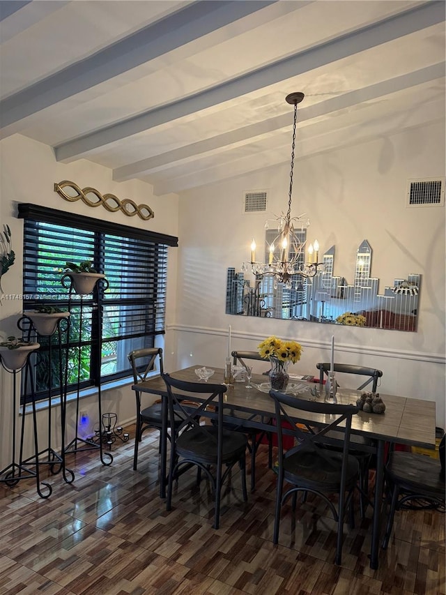 dining room with a chandelier, visible vents, lofted ceiling with beams, and wood finished floors