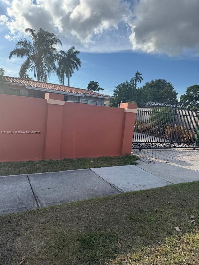 view of gate with fence