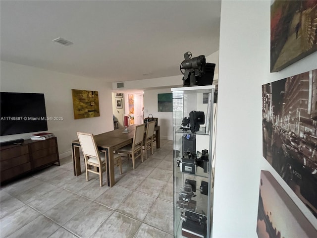 dining area with visible vents and light tile patterned floors