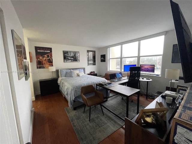 bedroom with wood finished floors