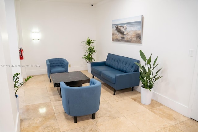 sitting room with tile patterned floors and baseboards