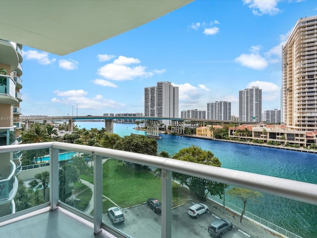 balcony with a view of city and a water view