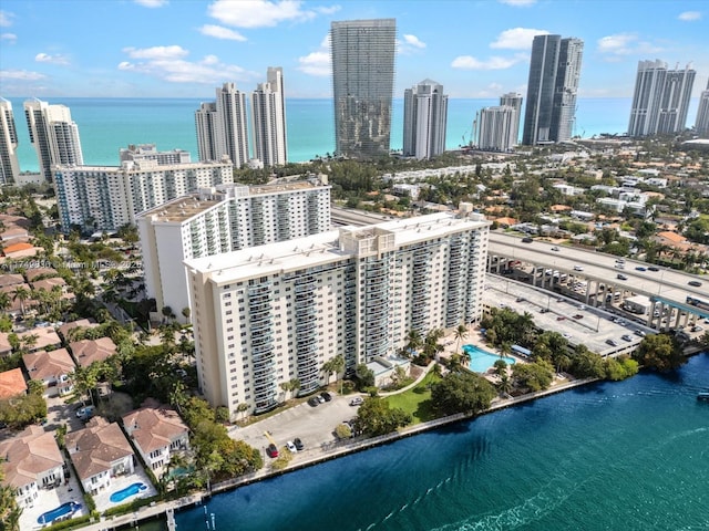 bird's eye view featuring a view of city and a water view