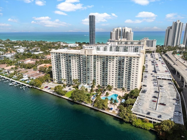 bird's eye view featuring a water view and a city view