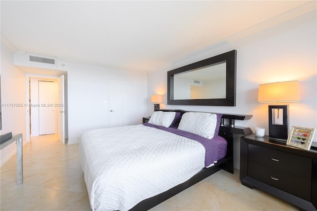 bedroom with light tile patterned floors, baseboards, visible vents, and crown molding