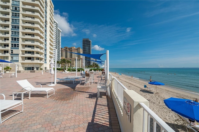 view of home's community with a view of city, a beach view, and a water view