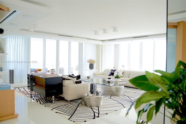 living room with a wealth of natural light and visible vents