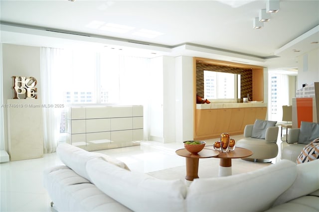 living room with tile patterned floors