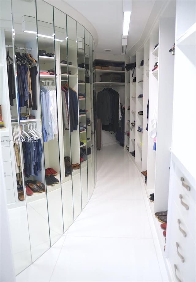 spacious closet featuring tile patterned floors