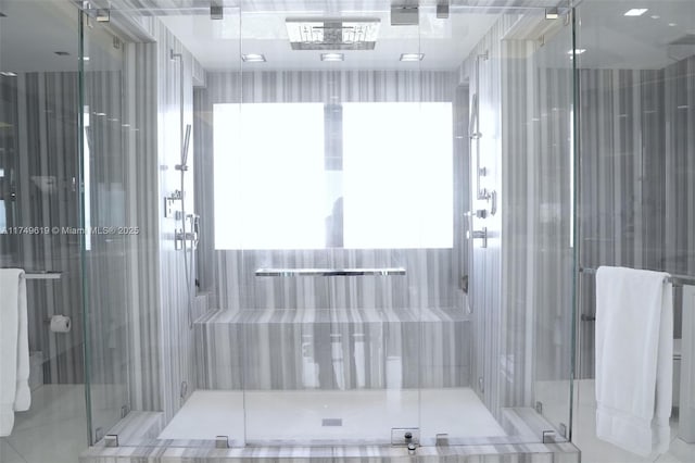 full bath with a shower stall