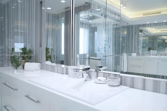 bathroom featuring visible vents and vanity