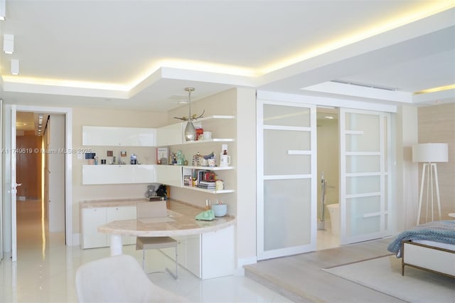 bedroom with visible vents and light tile patterned floors