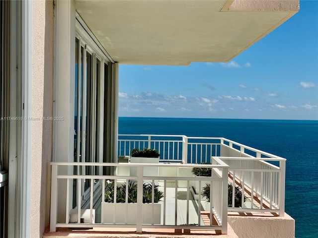 balcony featuring a water view