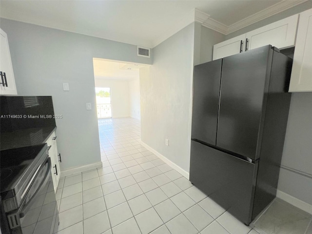 kitchen with dark countertops, visible vents, appliances with stainless steel finishes, and white cabinets