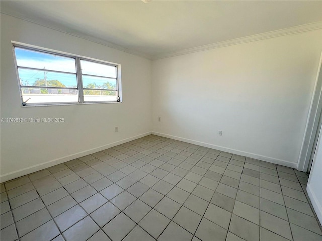 unfurnished room with crown molding and baseboards