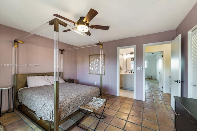 bedroom featuring ceiling fan, tile patterned flooring, and connected bathroom