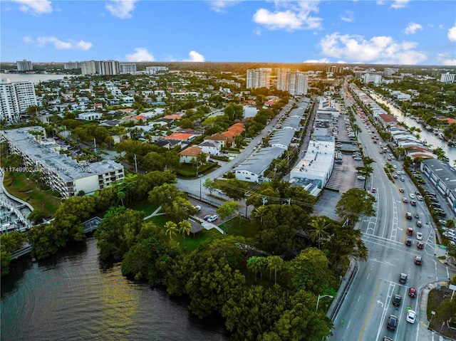 drone / aerial view featuring a view of city and a water view