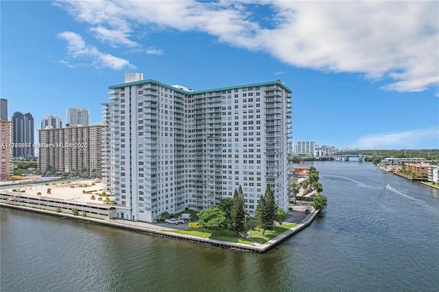 exterior space featuring a view of city and a water view