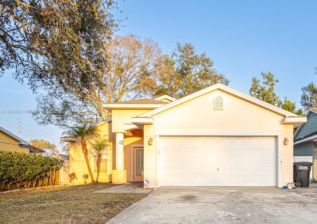 ranch-style house with concrete driveway, fence, an attached garage, and stucco siding