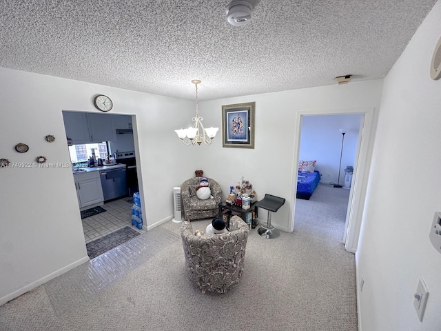 interior space with carpet floors, a textured ceiling, baseboards, and an inviting chandelier