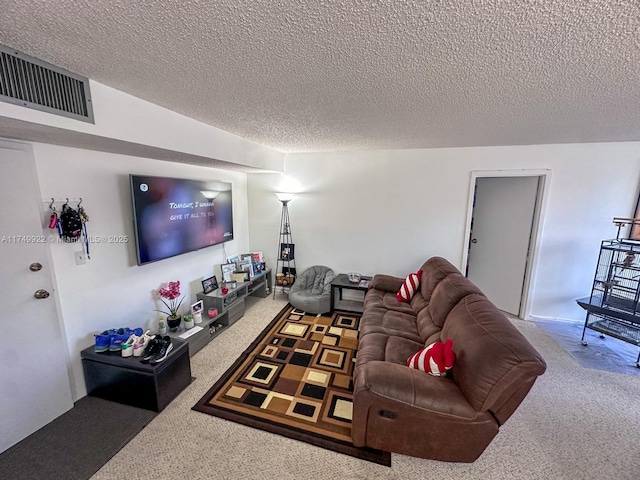 carpeted living room featuring a textured ceiling and visible vents