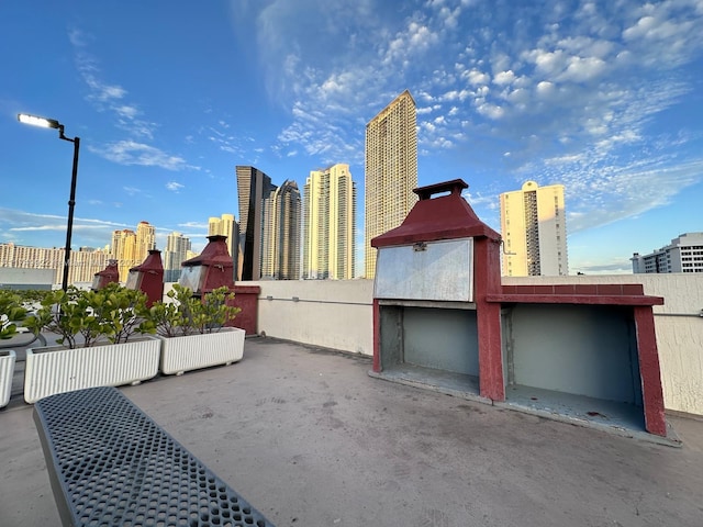 view of home's exterior featuring fence and a city view