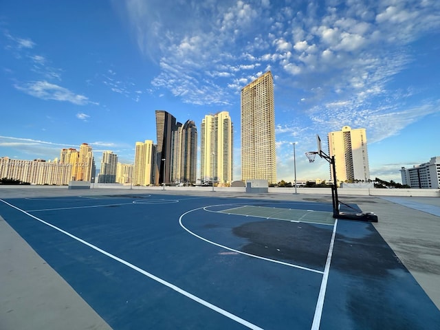 view of basketball court with a city view and community basketball court