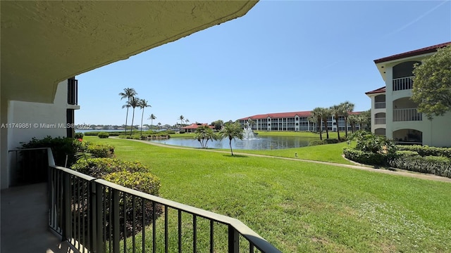 balcony featuring a water view