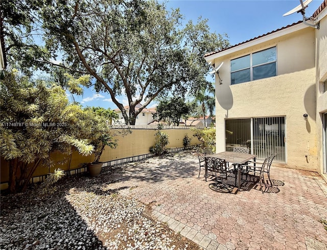 view of patio / terrace featuring outdoor dining area and a fenced backyard