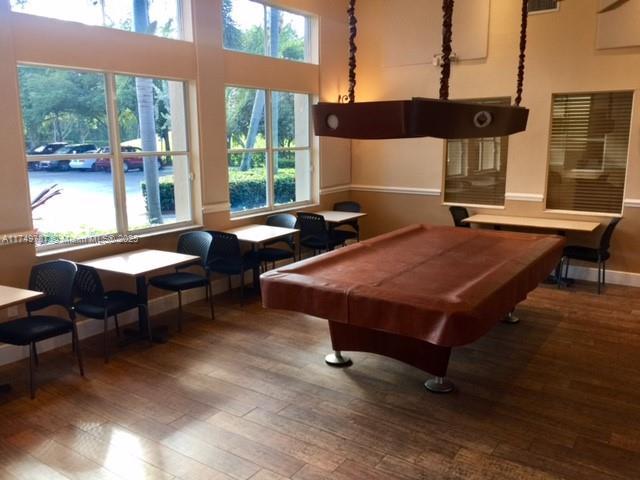 rec room featuring wood-type flooring, a wealth of natural light, billiards, and baseboards