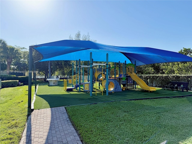 community play area with a lawn