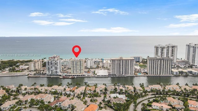 drone / aerial view featuring a water view and a city view