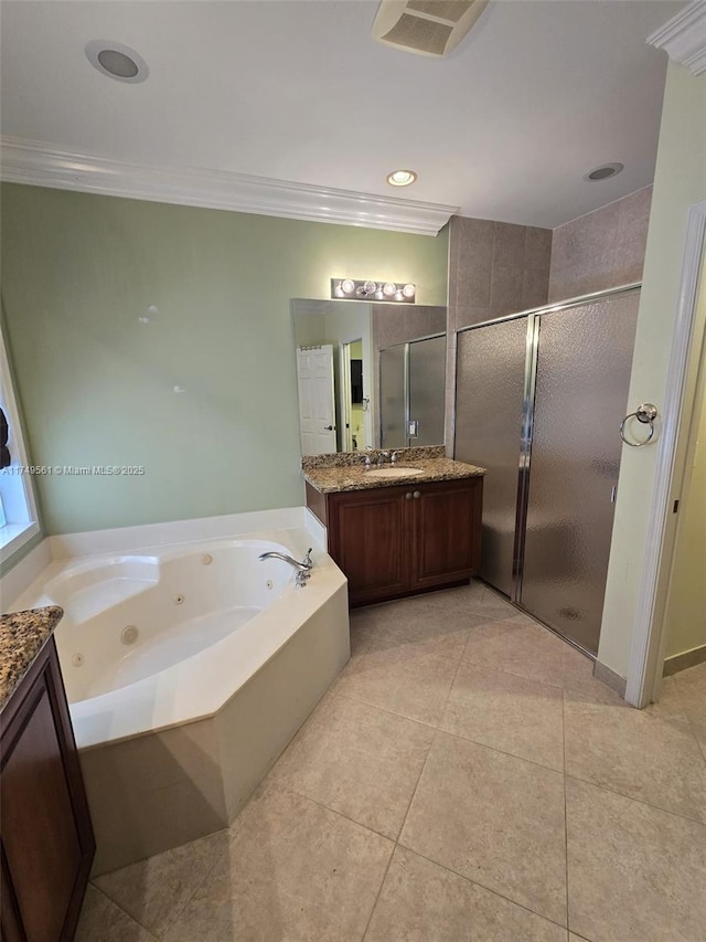 full bathroom with tile patterned flooring, vanity, ornamental molding, a tub with jets, and a stall shower