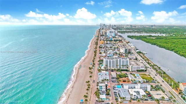 drone / aerial view with a view of the beach and a water view