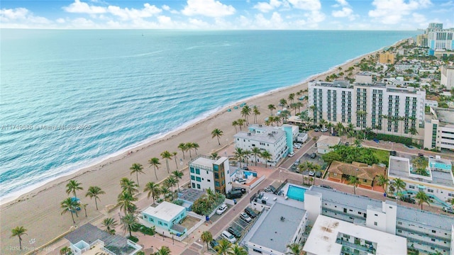 bird's eye view featuring a beach view and a water view