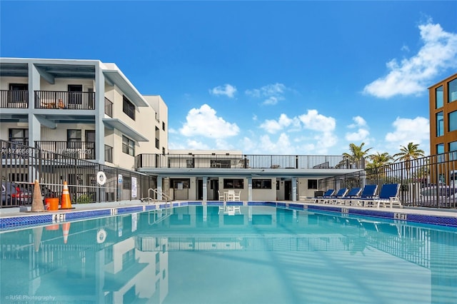 community pool featuring fence
