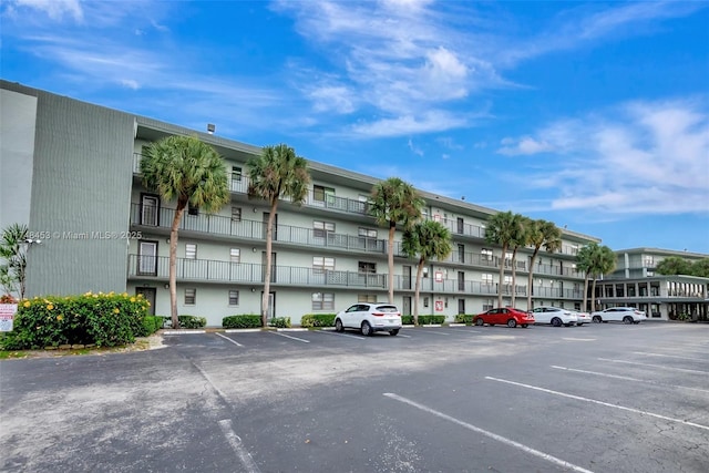 view of property with uncovered parking