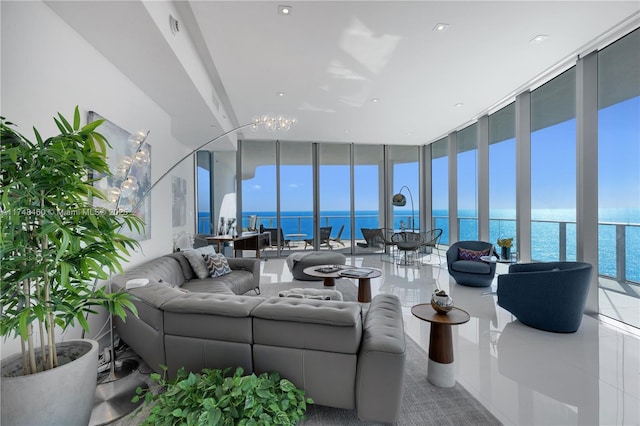 tiled living area featuring a wall of windows and a water view