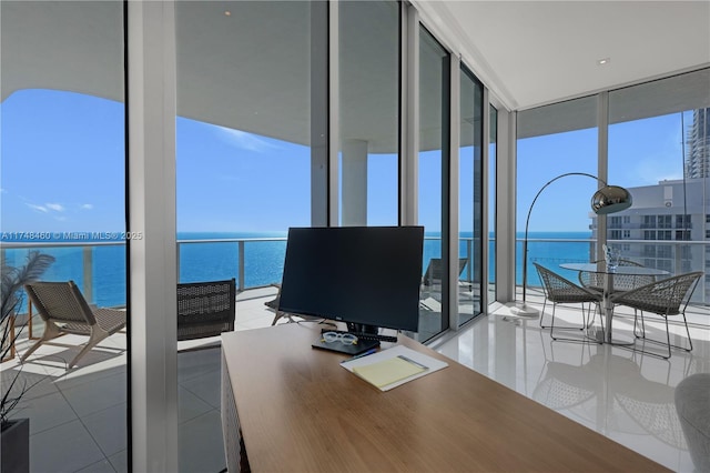 office area with floor to ceiling windows and light tile patterned floors