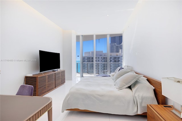 bedroom featuring access to outside and floor to ceiling windows