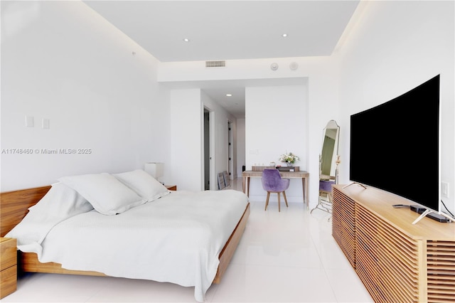 bedroom with light tile patterned floors, arched walkways, and recessed lighting