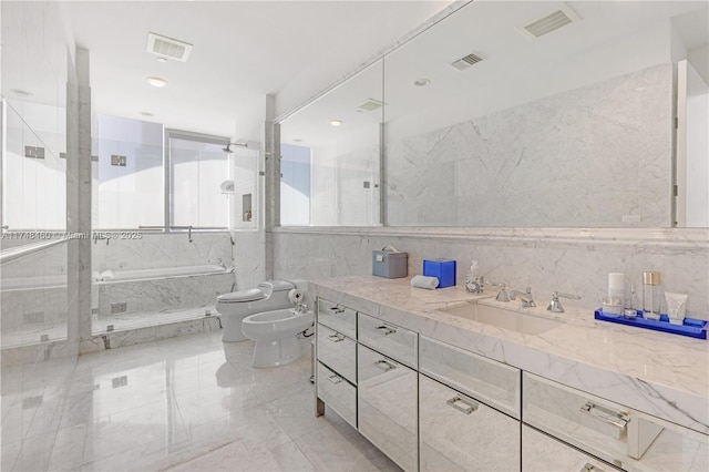 full bathroom featuring visible vents, a bidet, a tub with marble appearance, and tile walls