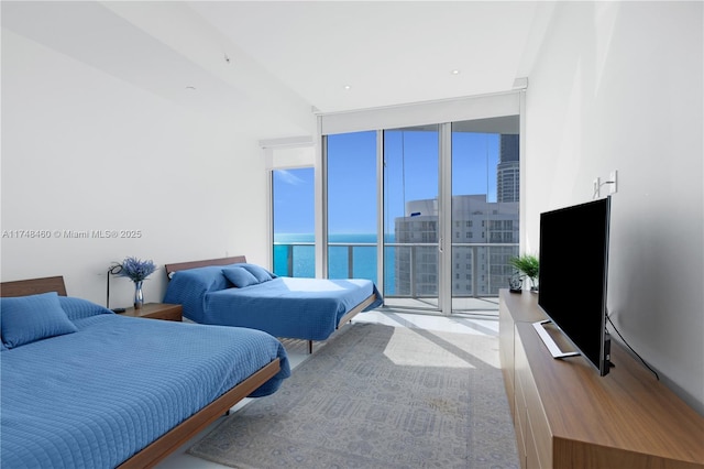 bedroom with access to outside and floor to ceiling windows