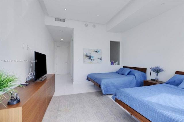 bedroom with light tile patterned flooring and visible vents